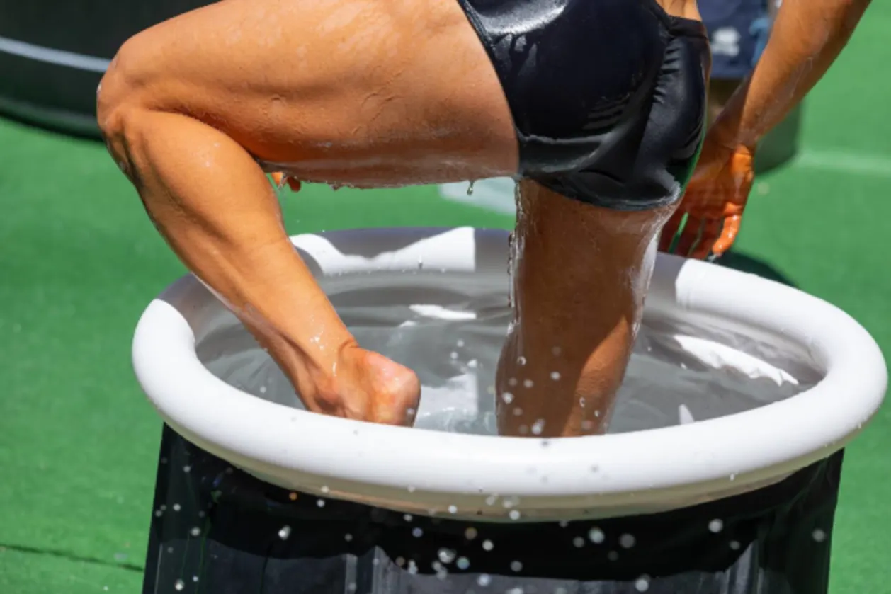 Man immersing in ice bath